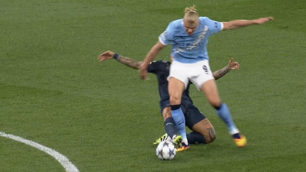 Referee Faces Tough Decision: Di Lorenzo Red Carded for Foul on Haaland