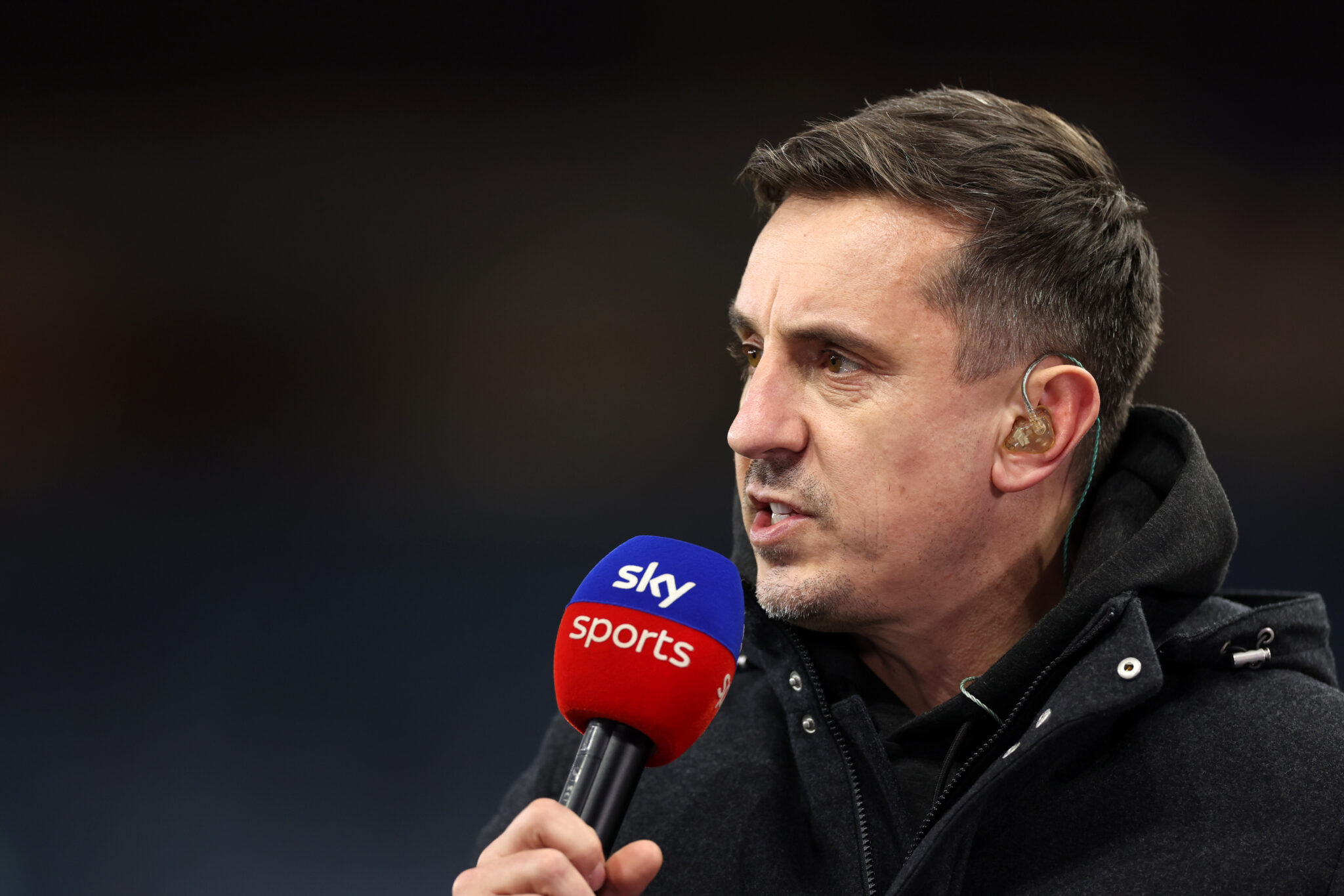 Neville Shares Concern for Arsenal in Title Race
