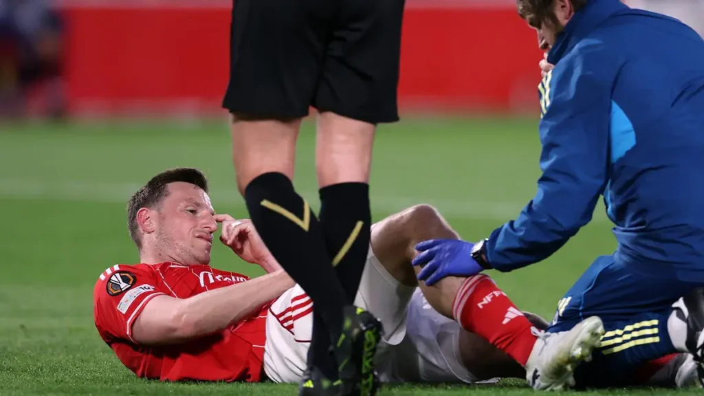 Nottingham striker Chris Wood suffers serious injury and is taken off the field