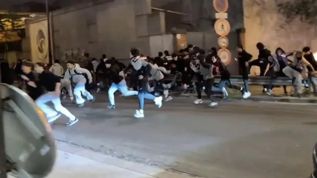 Fans clash with police amid smoky celebration in Paris.