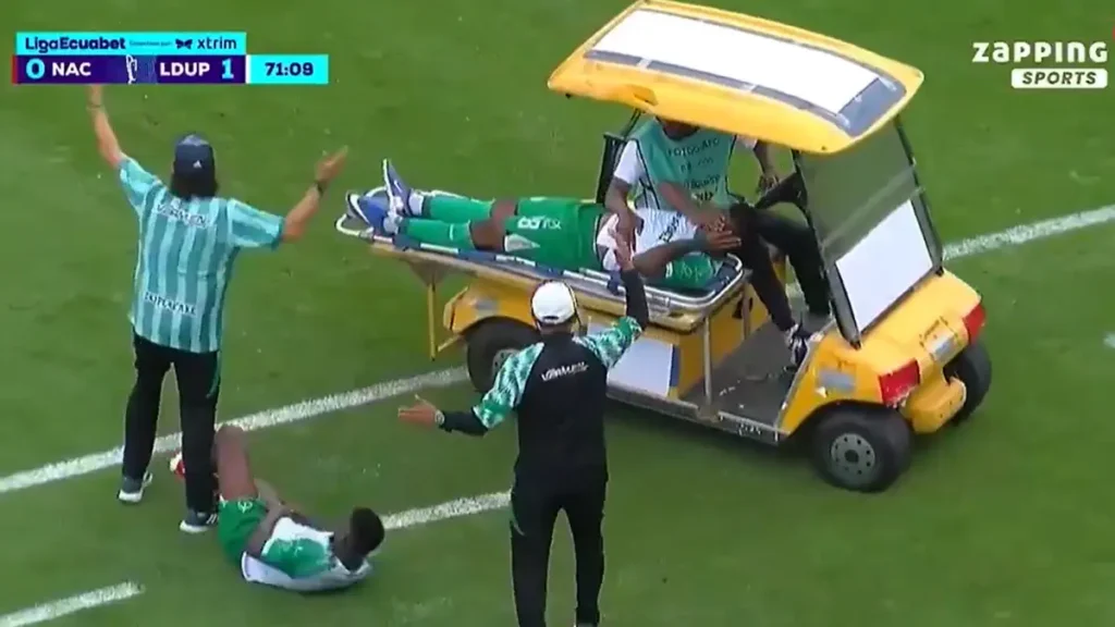 Ecuador match player injured after being run over by medical cart. VIDEO