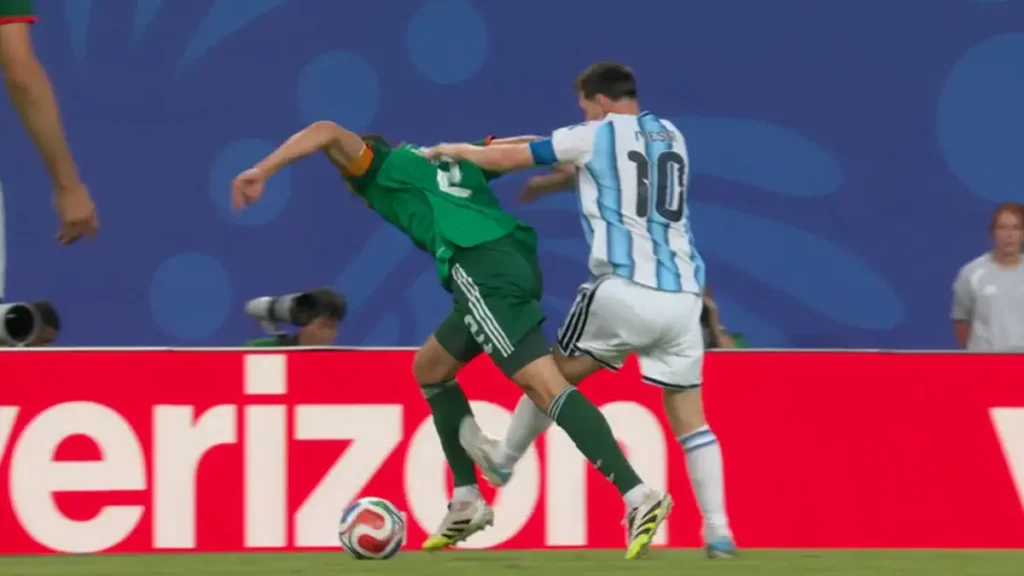 Referee overlooks rough foul by Lionel Messi, avoids a red card